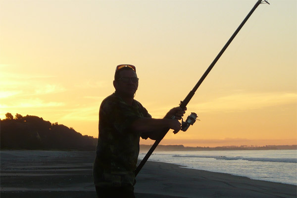 Fishing from a beach in the Bay of Plenty